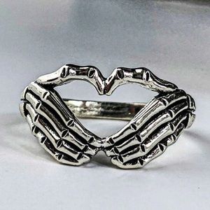 Skeleton hand heart ring